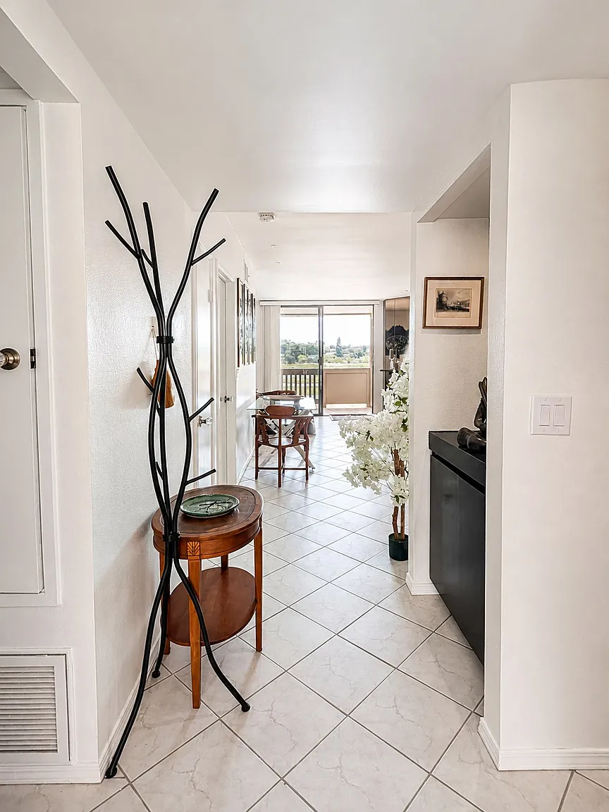 Entry foyer leading to the living room, furnished Point Loma condo