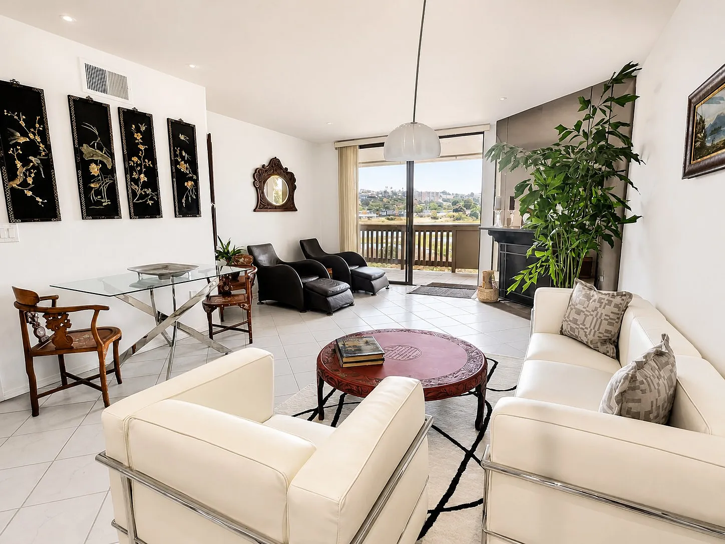Living room with lagoon view in a furnished 1-bedroom Point Loma condo