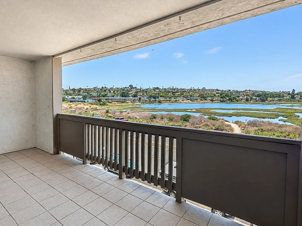 Private covered balcony with lagoon view at 3098 Rue d'Orleans #311, Point Loma