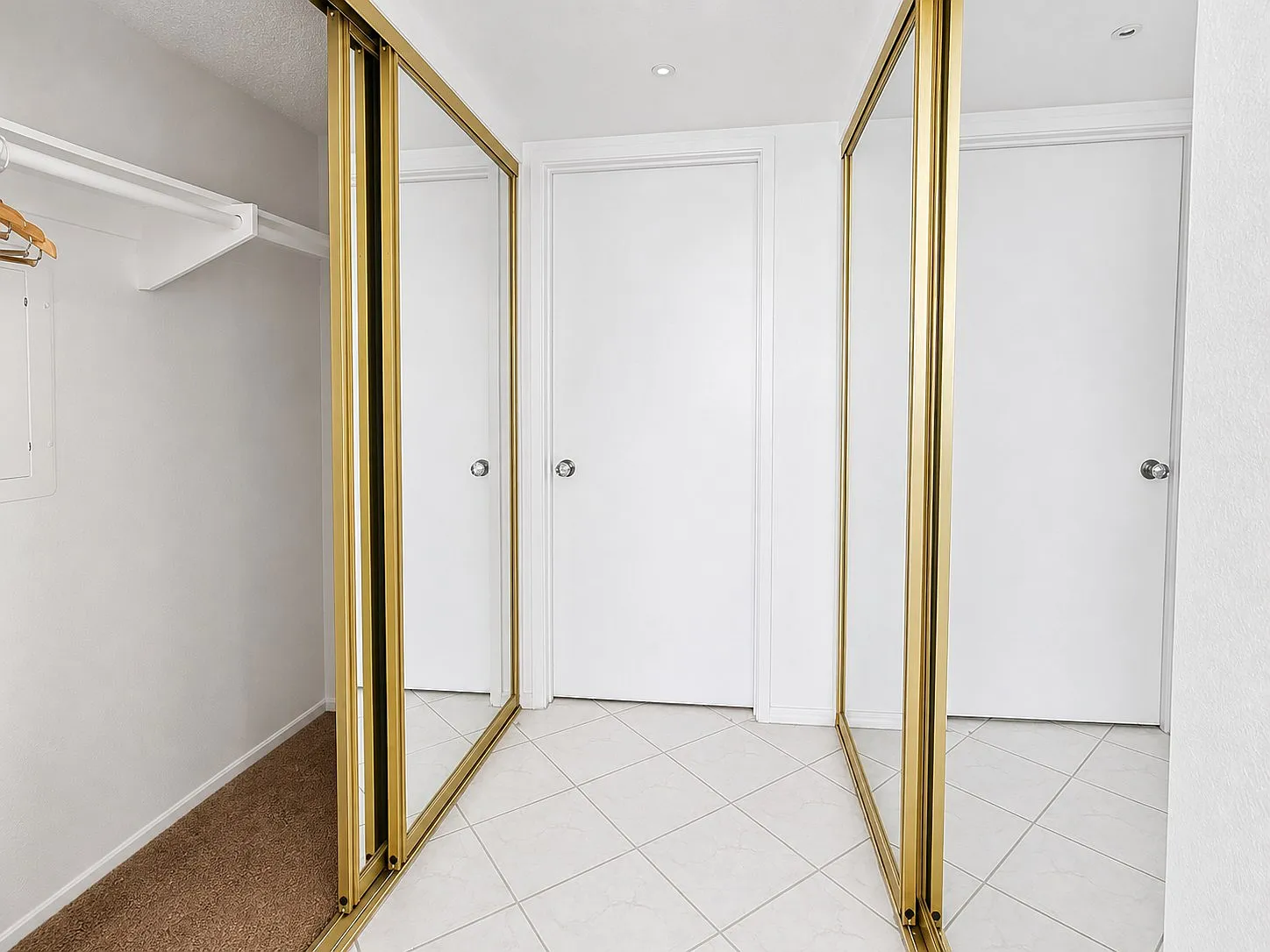 Walk-in closet with mirrored doors, Point Loma condo